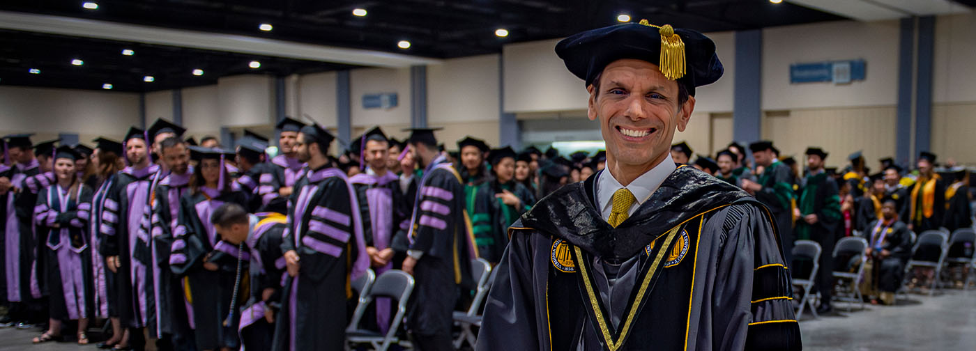 VCU President, Michael Rao, Ph.D., at a commencement ceremony with graduating students